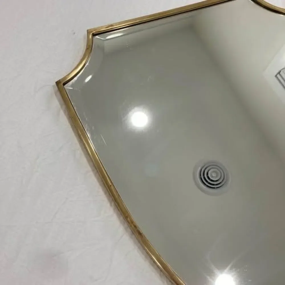 Pottery Barn brass shield shaped wall mirror